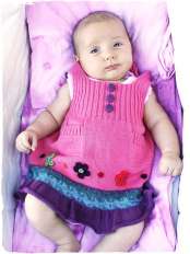 vestito di cotone per bambina lavorato a maglia